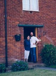 picture of Vicky & Holger in front of their new home